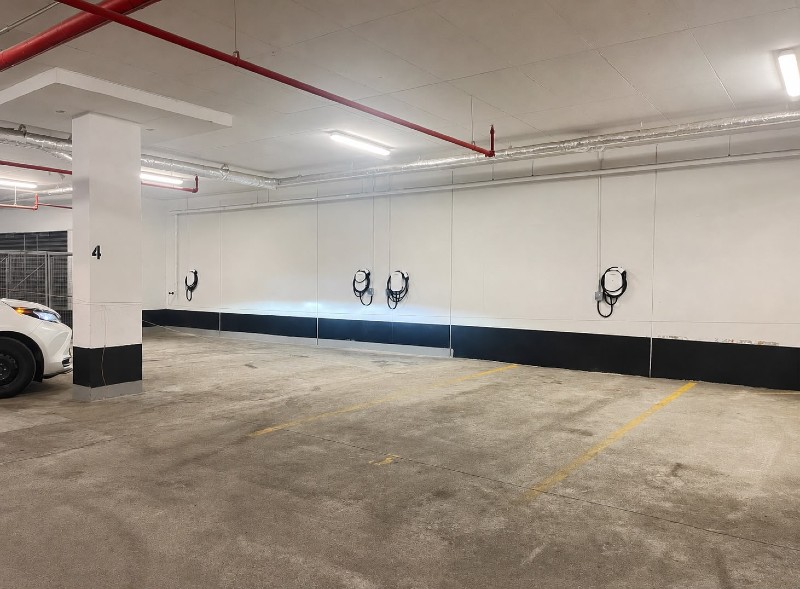 EV charger installed at an assigned parking stall in a condominium underground parking garage in Toronto